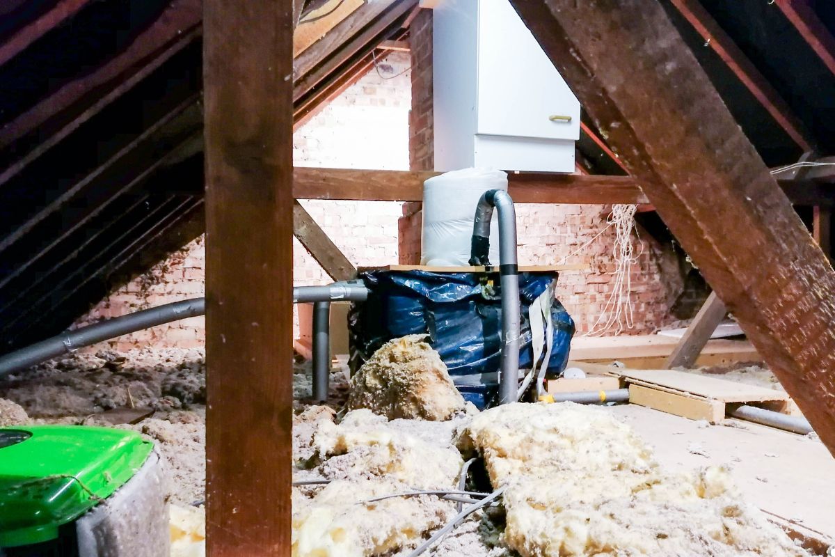 A room featuring wall insulation and a heater, designed for warmth and energy efficiency. 